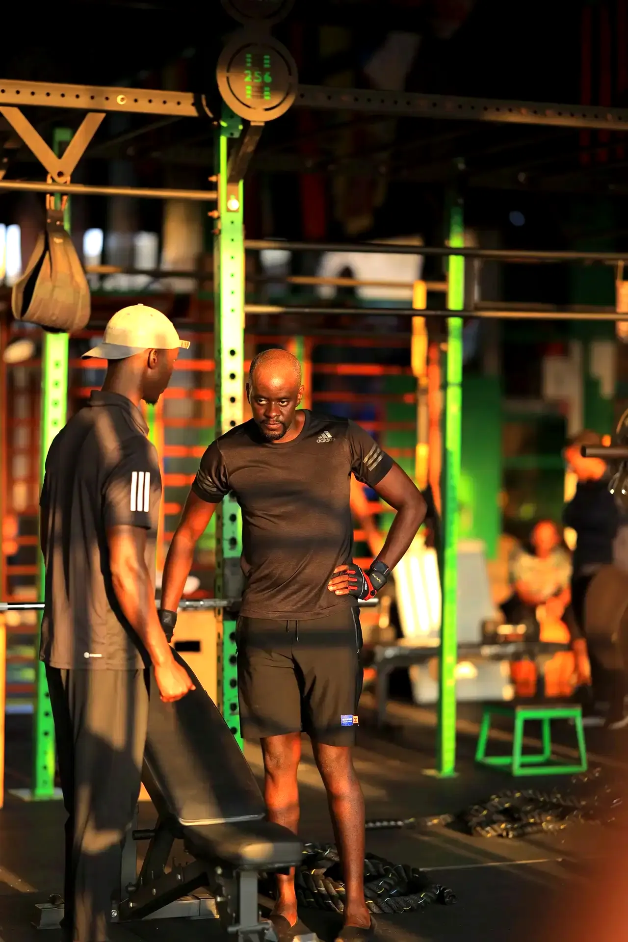 Coach guiding a member on the gym floor